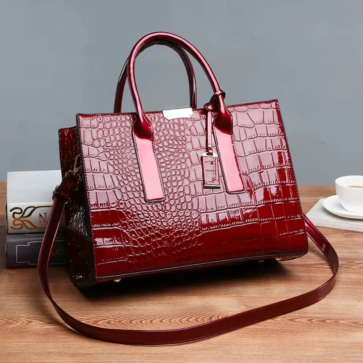 Women's crocodile print handbag