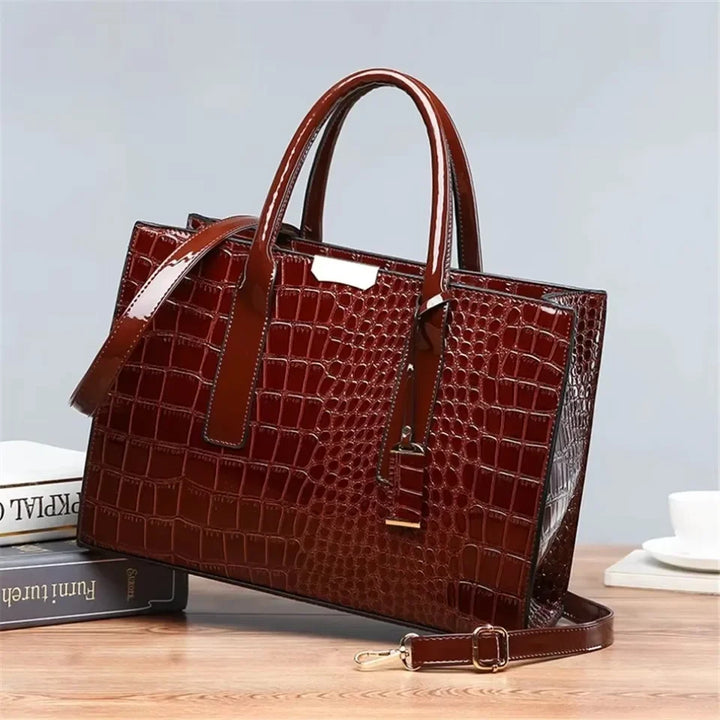 Women's crocodile print handbag