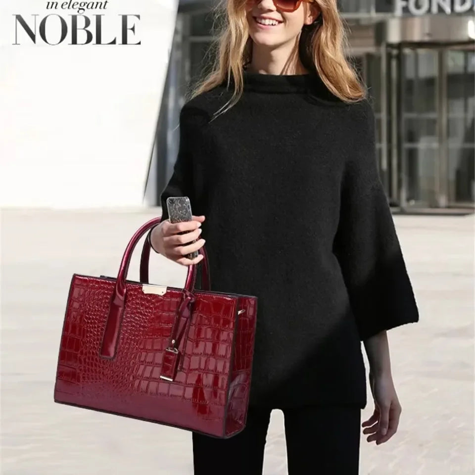Women's crocodile print handbag